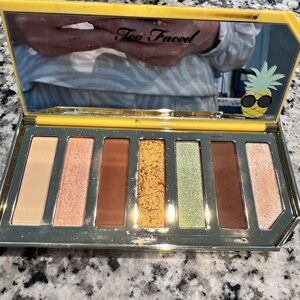 Too Faced Eyeshadow Palette with Gold and Green Hues